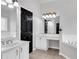 Main bathroom featuring dual sinks, vanity and soaking tub at 400 Kyle Ct, Fayetteville, GA 30215