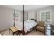 Spacious bedroom with hardwood floors, natural light, plantation shutters and a queen bed at 681 Hampton Sw Pl, Marietta, GA 30064