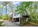 Two story home with brick and white siding, a walkout balcony and mature trees at 681 Hampton Sw Pl, Marietta, GA 30064