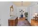 Elegant foyer with hardwood floors, decorative rug, and vintage furniture, creating a warm and inviting entrance at 681 Hampton Sw Pl, Marietta, GA 30064