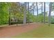 Well-maintained front yard with mature trees and green grass, enhancing the curb appeal of the property at 681 Hampton Sw Pl, Marietta, GA 30064