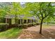 Charming home exterior, featuring a well-maintained lawn and lush greenery, offering a serene curb appeal at 681 Hampton Sw Pl, Marietta, GA 30064