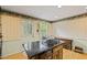 Functional kitchen with an island gas cooktop at 681 Hampton Sw Pl, Marietta, GA 30064