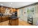 Traditional kitchen featuring an island gas cooktop and wooden cabinets at 681 Hampton Sw Pl, Marietta, GA 30064