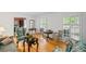 Bright living room featuring hardwood floors, shuttered windows, and classic furniture, creating a cozy and inviting atmosphere at 681 Hampton Sw Pl, Marietta, GA 30064