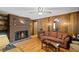 Charming living room with hardwood floors and a cozy brick fireplace at 681 Hampton Sw Pl, Marietta, GA 30064