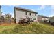 The backyard features a green lawn, wood fence, and a gazebo covered outdoor dining set at 1612 Nations Trl, Riverdale, GA 30296