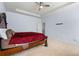 Primary bedroom featuring a tray ceiling, a ceiling fan and carpet flooring at 1612 Nations Trl, Riverdale, GA 30296