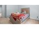 Bedroom with a plush bed, carpet flooring, and natural lighting at 1612 Nations Trl, Riverdale, GA 30296