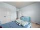 Bright bedroom with closet and blue dresser providing ample storage at 1612 Nations Trl, Riverdale, GA 30296
