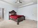 Primary bedroom with a tray ceiling and carpet flooring at 1612 Nations Trl, Riverdale, GA 30296