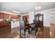 Open floorplan with a dining area adjacent to the kitchen featuring a chandelier at 1612 Nations Trl, Riverdale, GA 30296