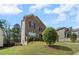 Charming two-story home with brick facade, blue shutters, and a lush green front yard at 1612 Nations Trl, Riverdale, GA 30296