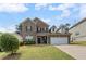 Beautiful two-story brick home featuring a well-manicured lawn and a two-car garage at 1612 Nations Trl, Riverdale, GA 30296