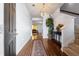Inviting foyer with hardwood floors, a decorative chandelier, and a view into the living area at 1612 Nations Trl, Riverdale, GA 30296