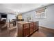 Open kitchen and dining area with granite counters, wood cabinets, and hardwood floors at 1612 Nations Trl, Riverdale, GA 30296