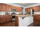 Modern kitchen with stainless steel appliances, granite countertops, and a functional center island at 1612 Nations Trl, Riverdale, GA 30296