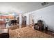 Expansive living room showcasing hardwood floors, an adjacent dining area, and a glimpse into the kitchen at 1612 Nations Trl, Riverdale, GA 30296