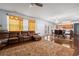 Open-concept living room with hardwood floors and a dining area, ideal for entertaining at 1612 Nations Trl, Riverdale, GA 30296