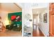 Stylish entryway with a view of a cozy living room and hallway featuring stylish decor and artwork at 190 Country Club Dr, Hiram, GA 30141