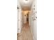 Hallway view with neutral carpet and a tree decal on the wall at 190 Country Club Dr, Hiram, GA 30141