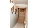 Carpeted staircase with decorative wall art leading to the lower level of the home at 190 Country Club Dr, Hiram, GA 30141