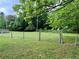 Expansive backyard showcasing lush green grass and a chainlink fence at 2659 Odum St, Snellville, GA 30078