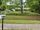 Well-manicured front yard with lush landscaping and a charming home at 2659 Odum St, Snellville, GA 30078
