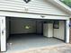 Garage interior featuring ample storage space, a window, and well-maintained concrete flooring at 2659 Odum St, Snellville, GA 30078