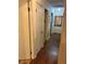 Hallway showcasing hardwood floors and access to various rooms at 2659 Odum St, Snellville, GA 30078