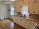 A kitchen with a double sink, ample counter space, overhead cabinets and linoleum flooring at 2659 Odum St, Snellville, GA 30078