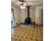 Cozy living room showcasing a vintage wood-burning stove, brick accent wall, and lots of natural light at 2659 Odum St, Snellville, GA 30078