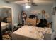 Bedroom with a closet and dresser, currently cluttered at 3683 Miller St, Lithia Springs, GA 30122