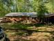 Charming brick home with mature trees and landscaping at 3683 Miller St, Lithia Springs, GA 30122