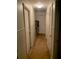 Hallway with carpet and doors at 3683 Miller St, Lithia Springs, GA 30122