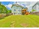 Large, well-manicured backyard featuring a spacious lawn, wooden fence and multi-level deck on the house at 2727 Lost Mill Trce, Buford, GA 30519