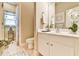 Bright bathroom with a large vanity and an open doorway at 2727 Lost Mill Trce, Buford, GA 30519