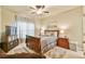 Bedroom featuring a dark wood bed set and a television at 2727 Lost Mill Trce, Buford, GA 30519