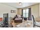 Bright bedroom with a work space and accent chair at 2727 Lost Mill Trce, Buford, GA 30519