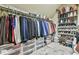 Organized walk-in closet with clothing racks, shelves, and storage bins at 2727 Lost Mill Trce, Buford, GA 30519