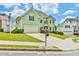 Charming two-story home with an attached garage and a beautifully landscaped front yard on a sunny day at 2727 Lost Mill Trce, Buford, GA 30519