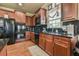 This kitchen features cherry wood cabinets, granite counters, and stainless steel appliances at 2727 Lost Mill Trce, Buford, GA 30519