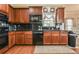 Well-equipped kitchen featuring sleek black countertops, stainless steel appliances, and ample cabinet storage at 2727 Lost Mill Trce, Buford, GA 30519
