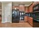 A spacious kitchen features stainless appliances, plenty of cabinet space, and hardwood floors at 2727 Lost Mill Trce, Buford, GA 30519
