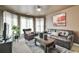 Comfortable living room featuring a sofa, armchair, and natural light at 2727 Lost Mill Trce, Buford, GA 30519