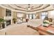 The primary bedroom features tray ceilings, a fireplace, and a sitting area with bay windows at 2727 Lost Mill Trce, Buford, GA 30519