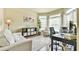 Comfortable home office featuring hardwood floors, neutral color scheme, and abundant natural light at 2727 Lost Mill Trce, Buford, GA 30519