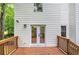 View of a wooden deck with access to the house through glass double doors at 3880 Northpoint Dr, Marietta, GA 30062