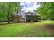 Exterior view of house from the back with large backyard and deck at 3880 Northpoint Dr, Marietta, GA 30062