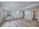 Spacious basement with light vinyl floors, recessed lighting, and easy access to an adjacent bathroom at 3880 Northpoint Dr, Marietta, GA 30062
